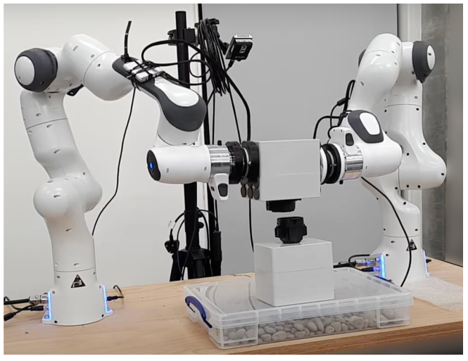 Haptic Bimanual System for Teleoperation of Time-Delayed Tasks